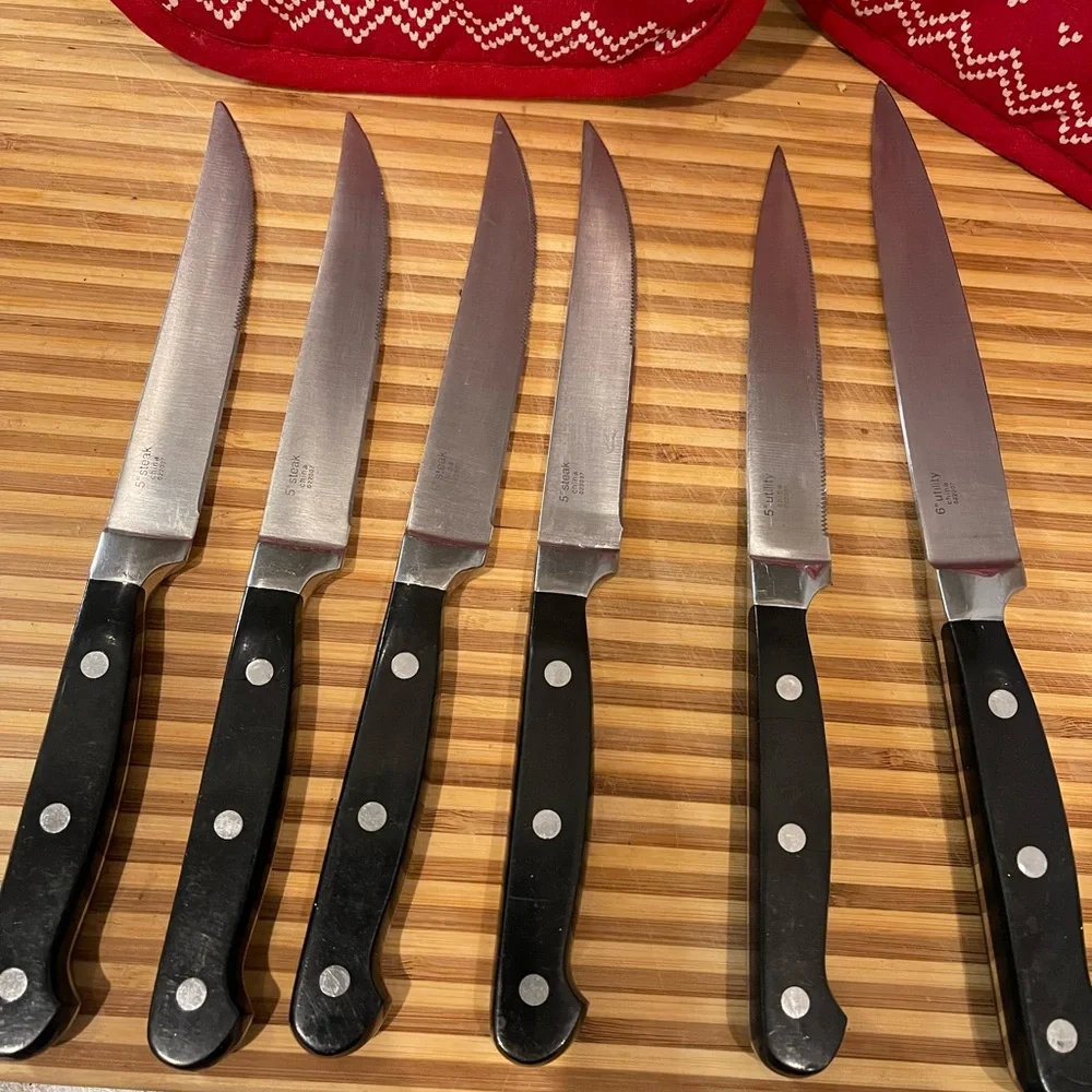 Set of Six Black Handle Wolfgang Puck Steak Knives